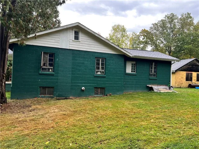 a front view of a house with yard