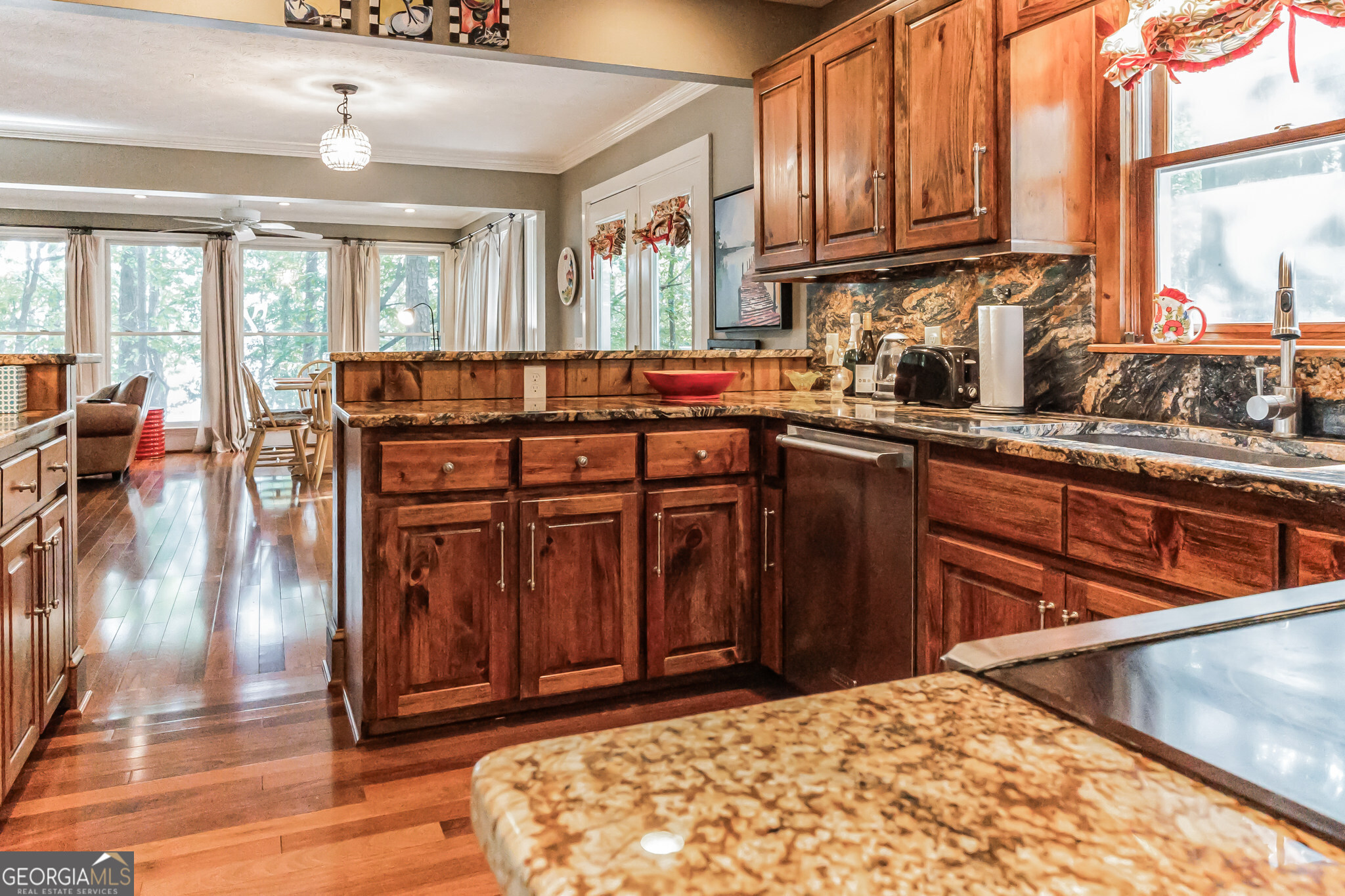 455 Chase Landing Martin, GA 30557 - Photo 11 of 37 a kitchen with stainless steel appliances granite countertop a stove a sink dishwasher and cabinets with wooden floor