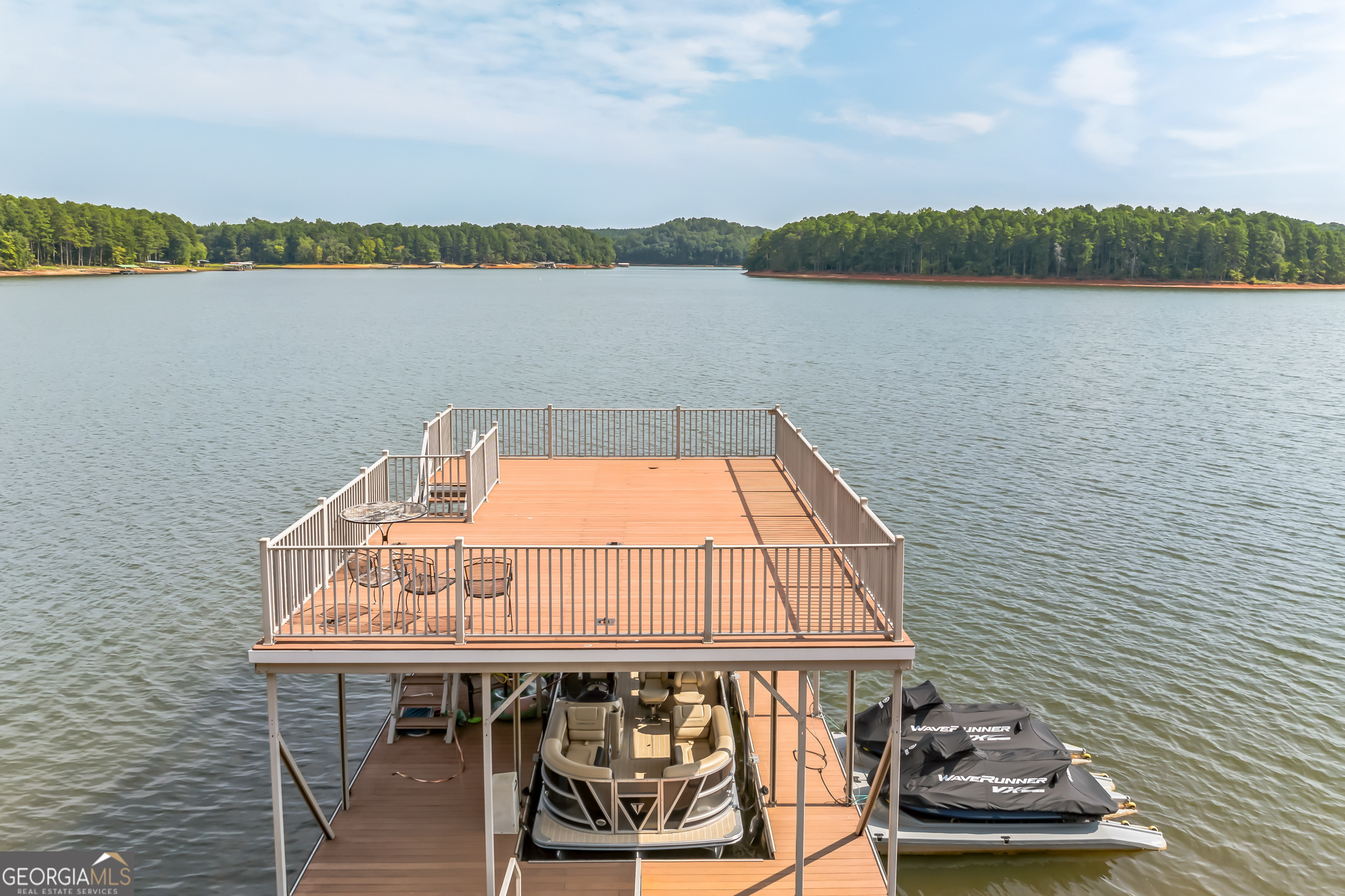 455 Chase Landing Martin, GA 30557 - Photo 20 of 37 a view of a lake with a table and chairs