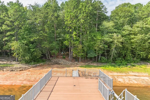 a view of a backyard with swimming pool
