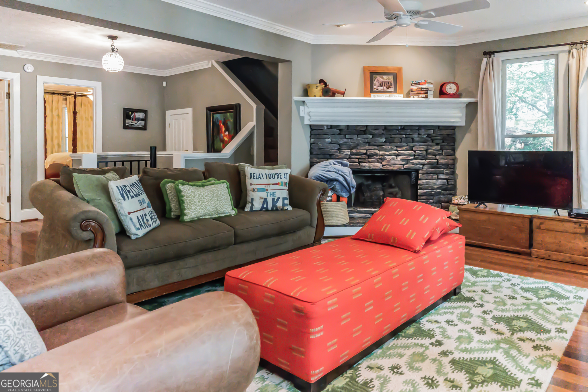 455 Chase Landing Martin, GA 30557 - Photo 6 of 37 a living room with furniture a flat screen tv and a fireplace