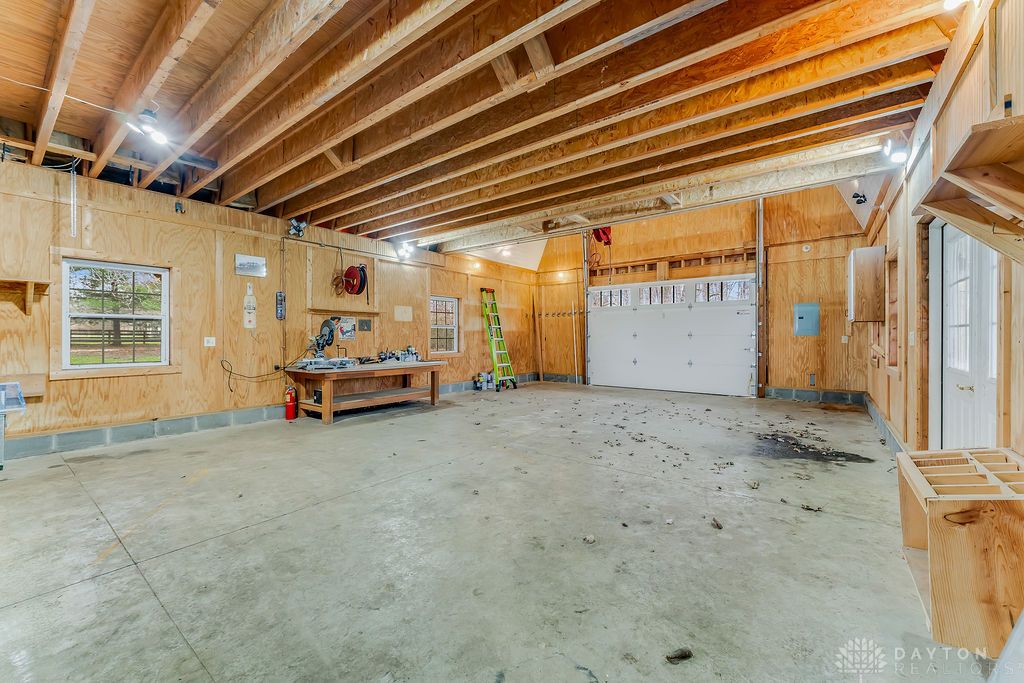 7400 Cook-Jones Road Waynesville, OH 45068 - Photo 60 of 72 This spacious and bright garage offers ample room for vehicles and projects.
