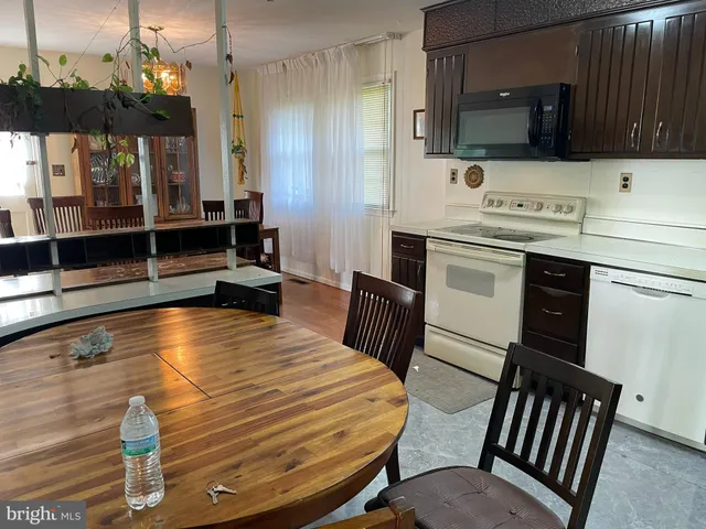 a bathroom with a sink a mirror and a bathtub