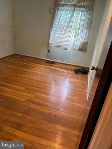 a view of room with wooden floor