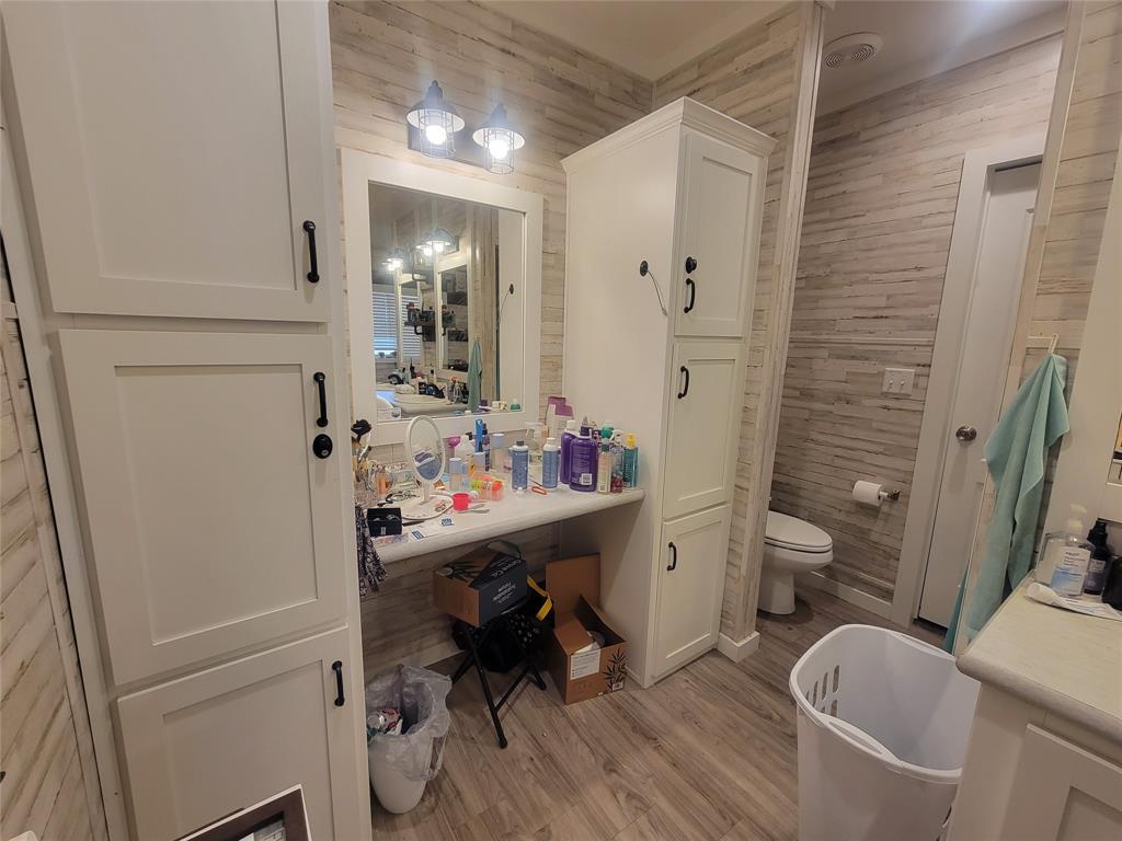 150 Hawkins Chapel Road Loving, TX 76460 - Photo 20 of 40 a bathroom with a sink a toilet and shower