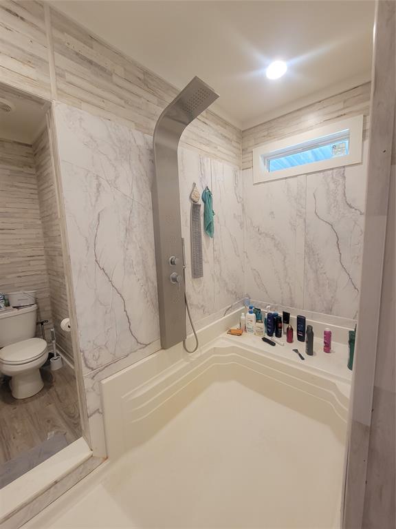 150 Hawkins Chapel Road Loving, TX 76460 - Photo 21 of 40 a bathroom with a sink and a toilet