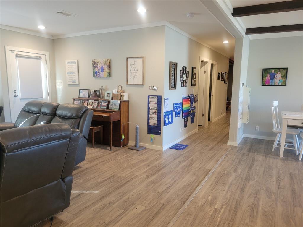 150 Hawkins Chapel Road Loving, TX 76460 - Photo 27 of 40 a living room with furniture and a wooden floor