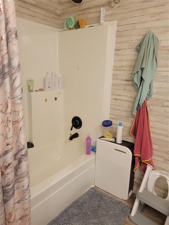 150 Hawkins Chapel Road Loving, TX 76460 - Photo 28 of 40 a bathroom with a bathtub and a shower