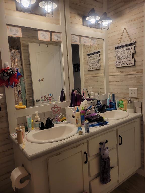 150 Hawkins Chapel Road Loving, TX 76460 - Photo 29 of 40 a bathroom with a sink and a mirror