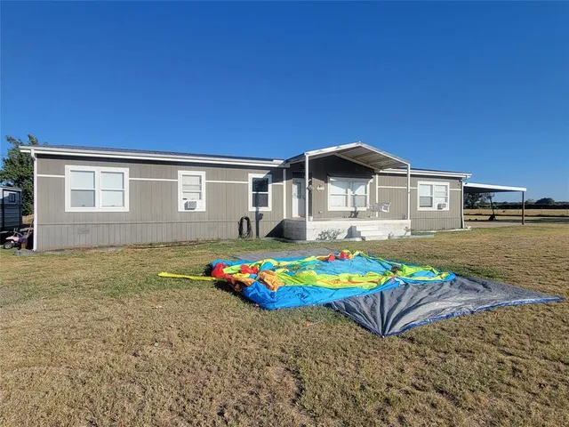 a front view of house with an outdoor space