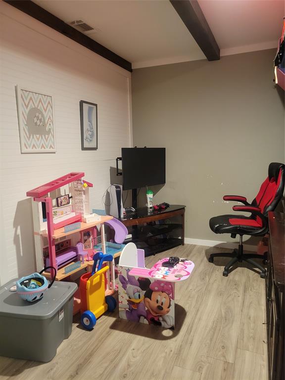 150 Hawkins Chapel Road Loving, TX 76460 - Photo 31 of 40 a bedroom with furniture and a flat screen tv