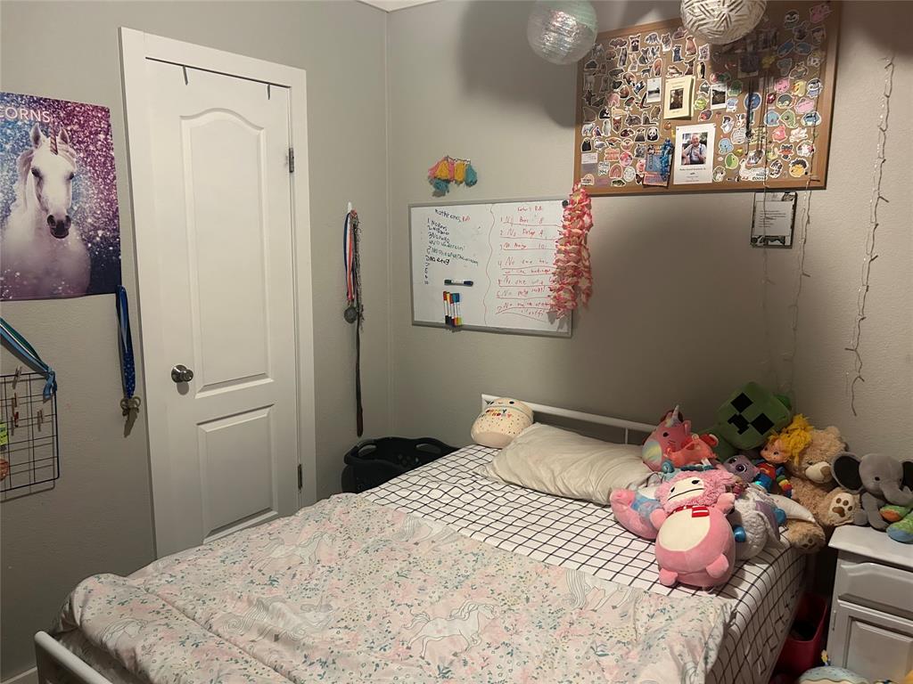 150 Hawkins Chapel Road Loving, TX 76460 - Photo 38 of 40 a bedroom with a bed and a window