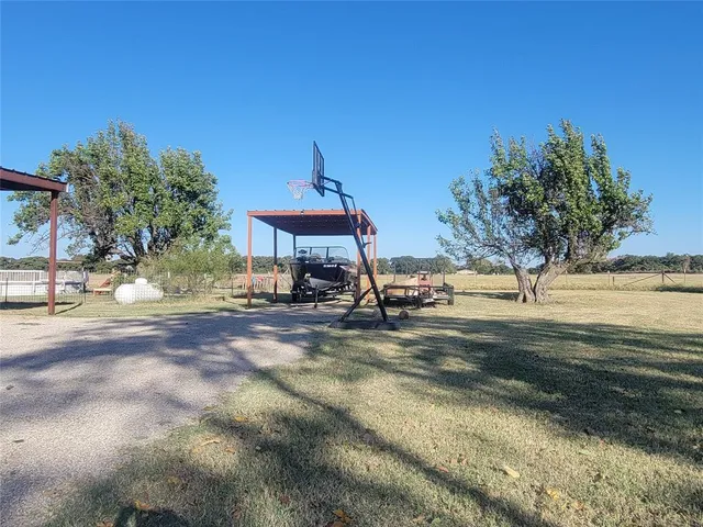 a view of a park with swings and slides