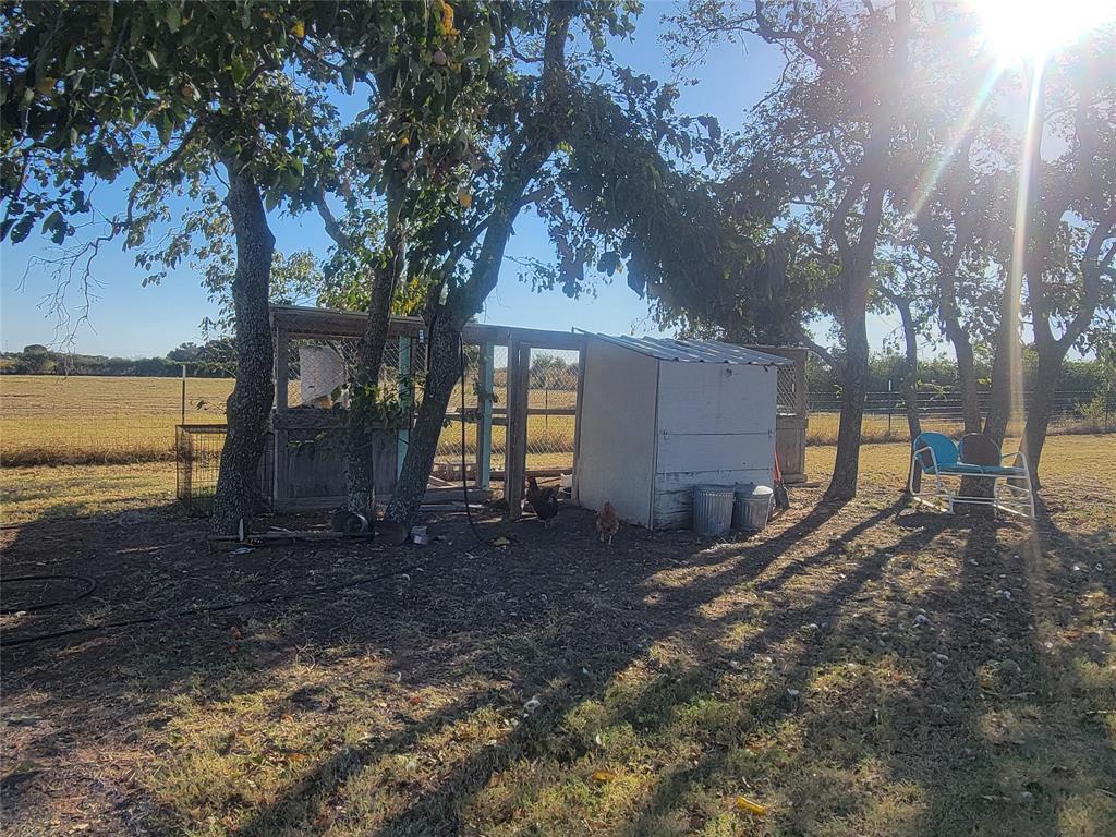 150 Hawkins Chapel Road Loving, TX 76460 - Photo 6 of 40 a backyard of a house with lots of green space
