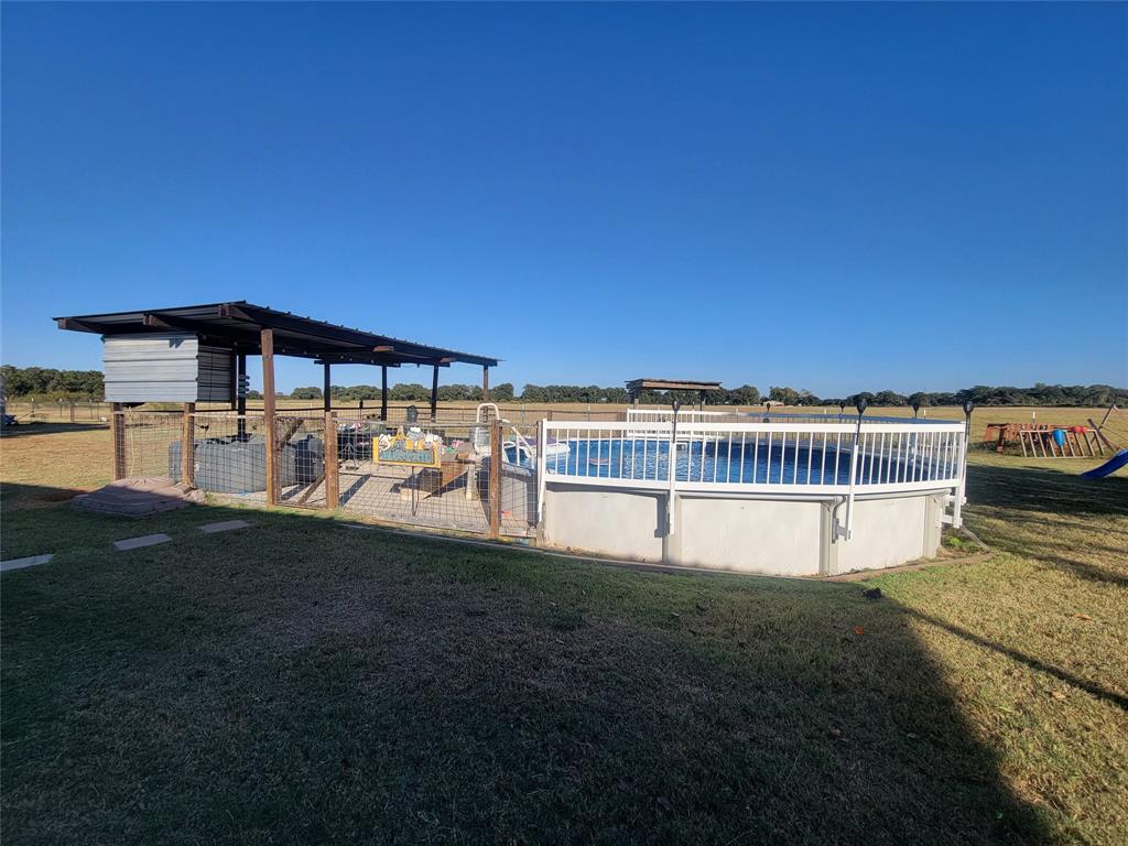 150 Hawkins Chapel Road Loving, TX 76460 - Photo 9 of 40 a view of a house with a yard