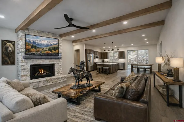 a living room with furniture and a fireplace