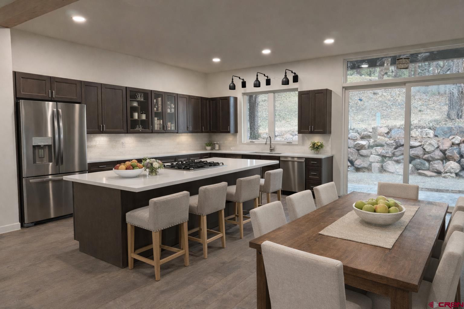 467 Hogan Circle Durango, CO 81301 - Photo 3 of 8 a kitchen with a dining table and chairs