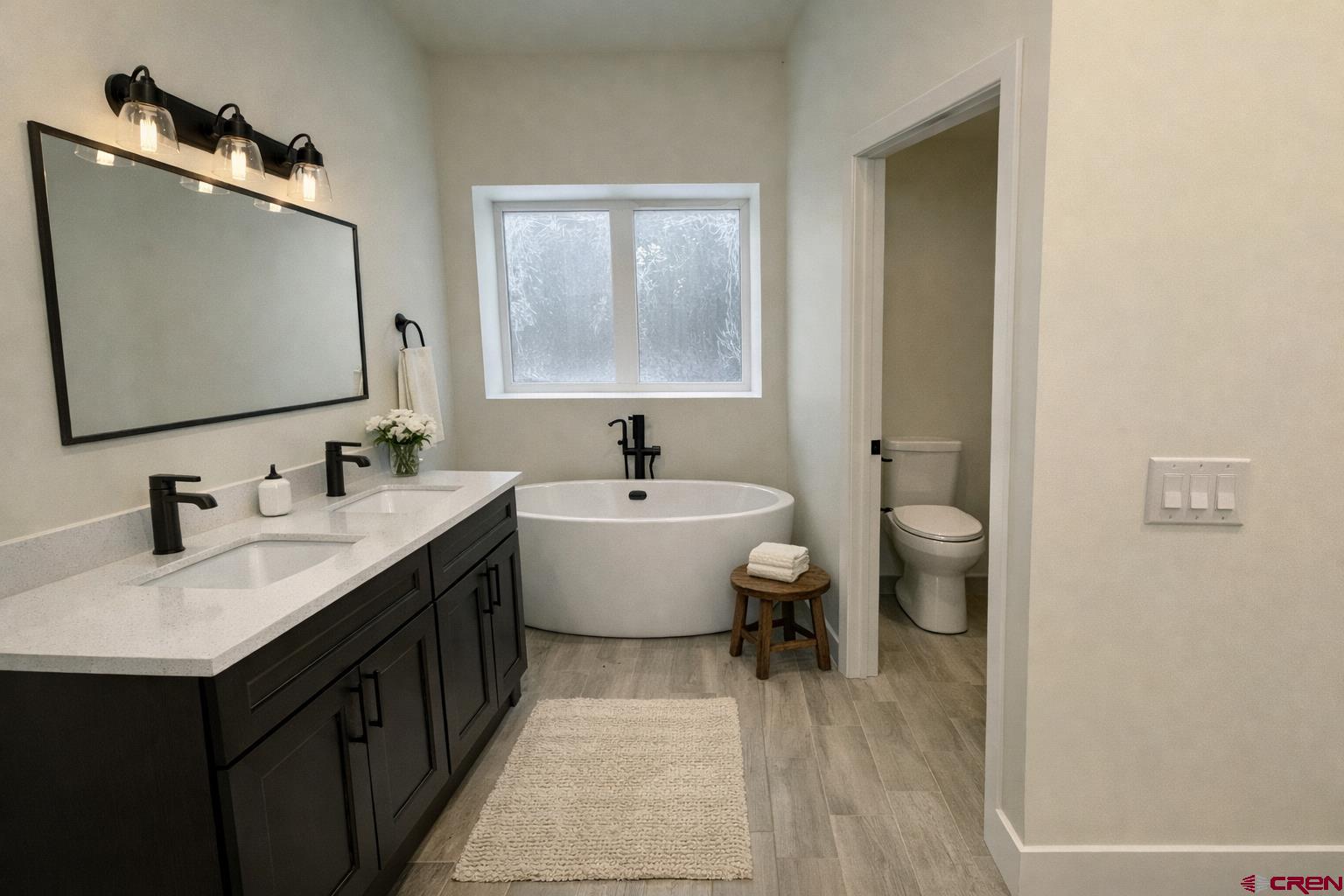 467 Hogan Circle Durango, CO 81301 - Photo 5 of 8 a bathroom with a double vanity sink mirror and toilet