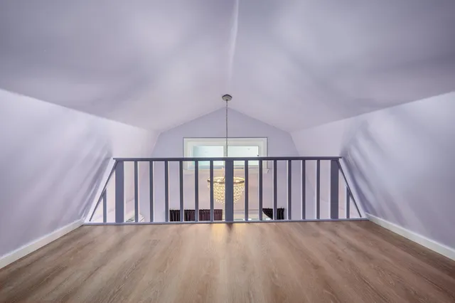 a view of an entryway with wooden floor