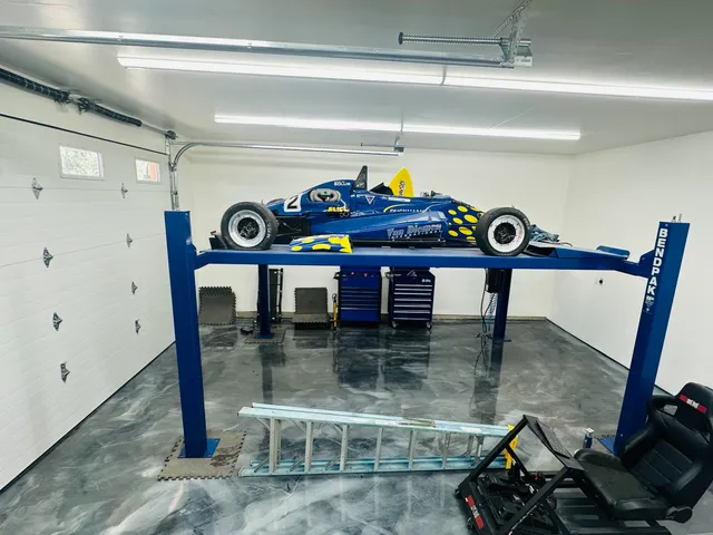 a front view of a house with parking space