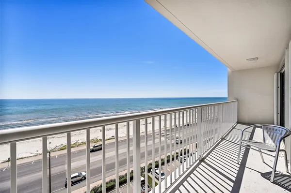 a balcony with wooden floor