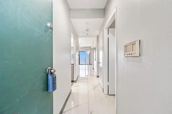 a view of a hallway with closet