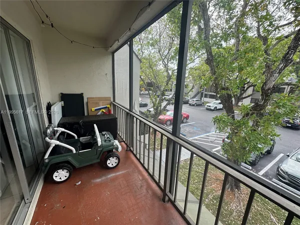 a view of a balcony with chairs