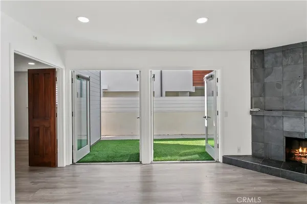 a view of livingroom with hardwood floor and a fireplace