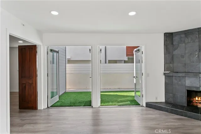 a view of livingroom with hardwood floor and a fireplace
