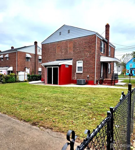 a brick house with a yard