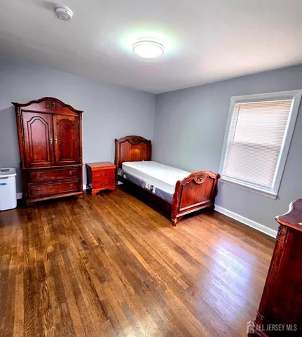 a room with furniture and wooden floor