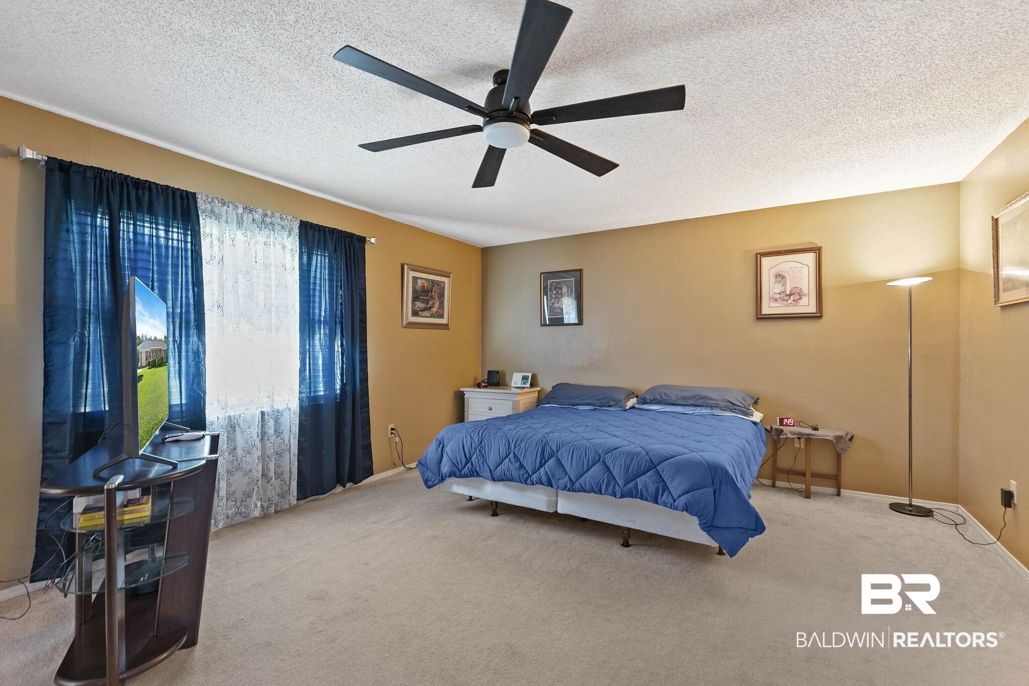 1510 South Juniper Street Foley, AL 36535 - Photo 19 of 36 Carpeted bedroom featuring a textured ceiling and a ceiling fan