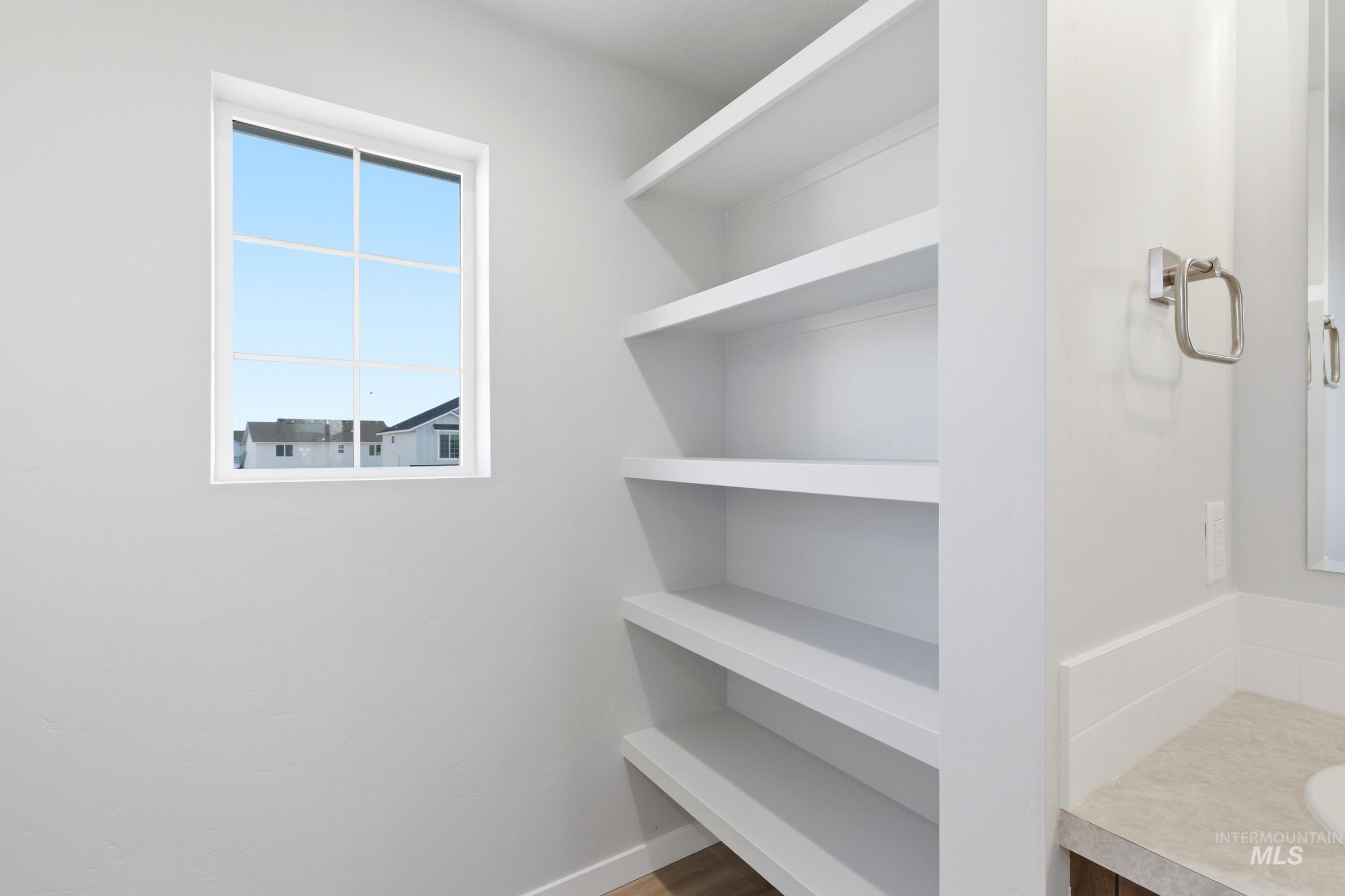 13709 Redway Court Caldwell, ID 83607 - Photo 24 of 28 Built-in shelving unit providing storage and organization
