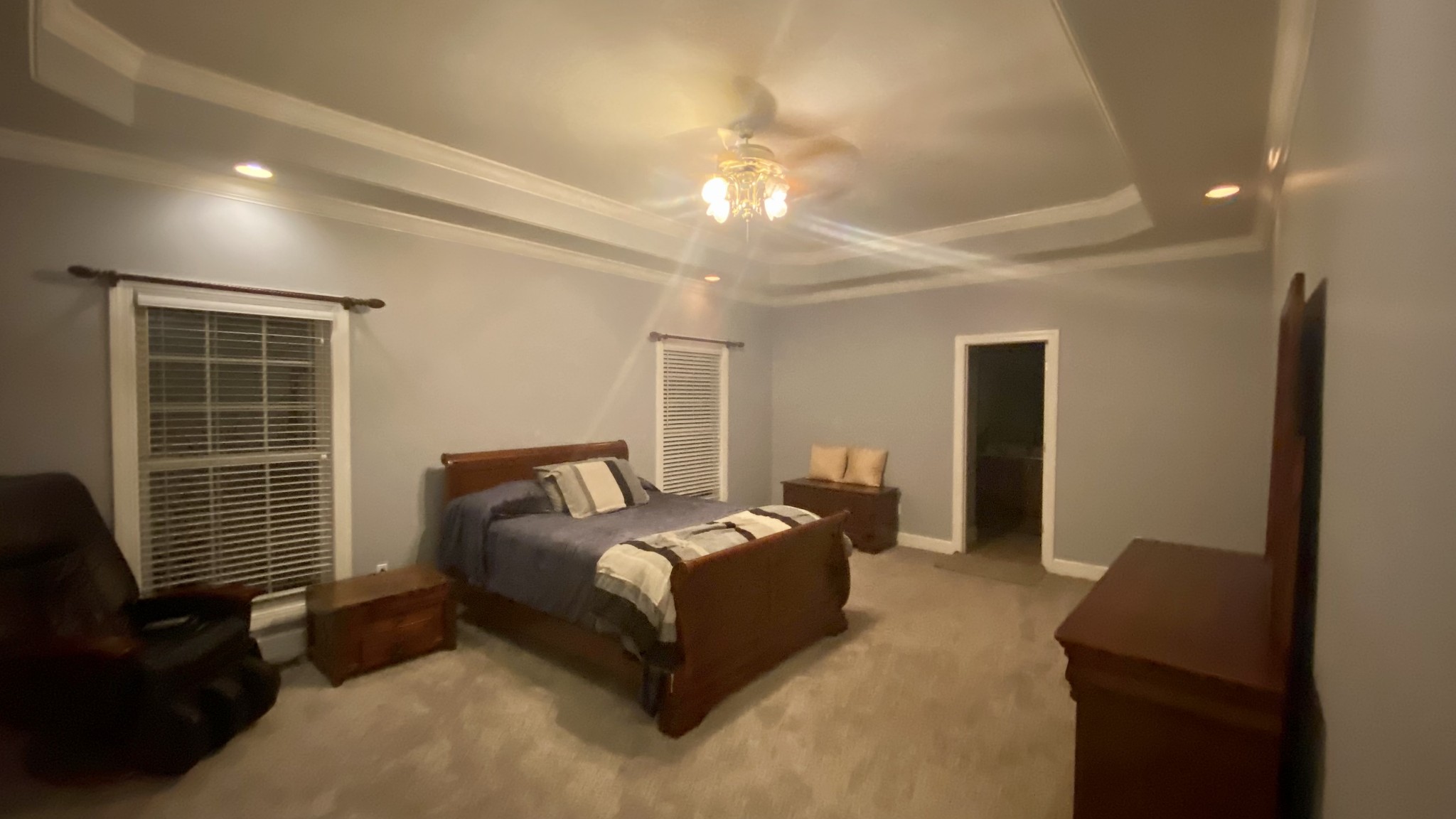 331 Duck River Road Manchester, TN 37355 - Photo 13 of 26 a spacious bedroom with a bed and a chandelier