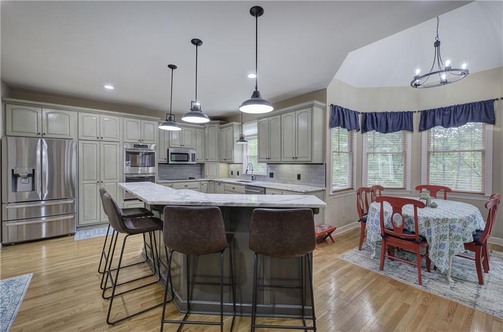 181 Fox Den Circle Jasper, GA 30143 - Photo 22 of 111 a view of a dining room with furniture window and wooden floor