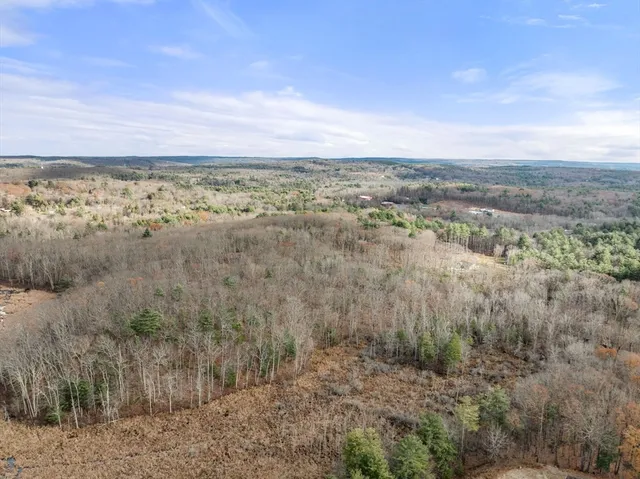 a view of a lake with a yard