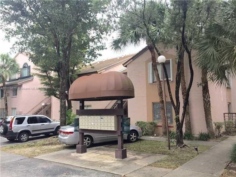 9079 Southwest 138th Place, Unit 9079 Miami, FL 33186 - Photo 20 of 34 a view of a street with cars