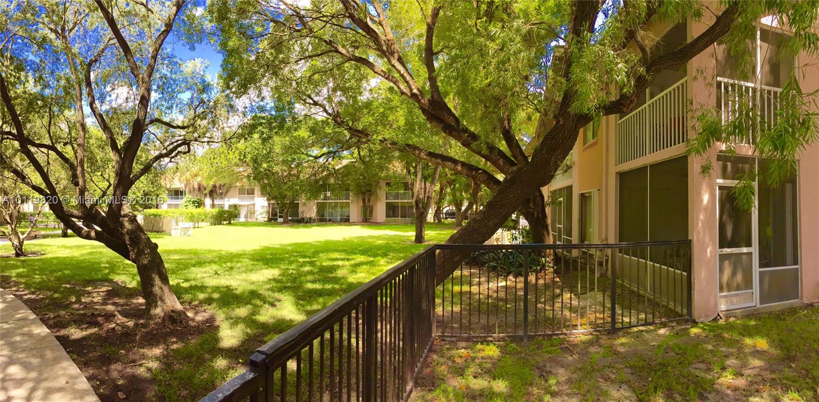 9079 Southwest 138th Place, Unit 9079 Miami, FL 33186 - Photo 2 of 34 a view of swimming pool with a patio