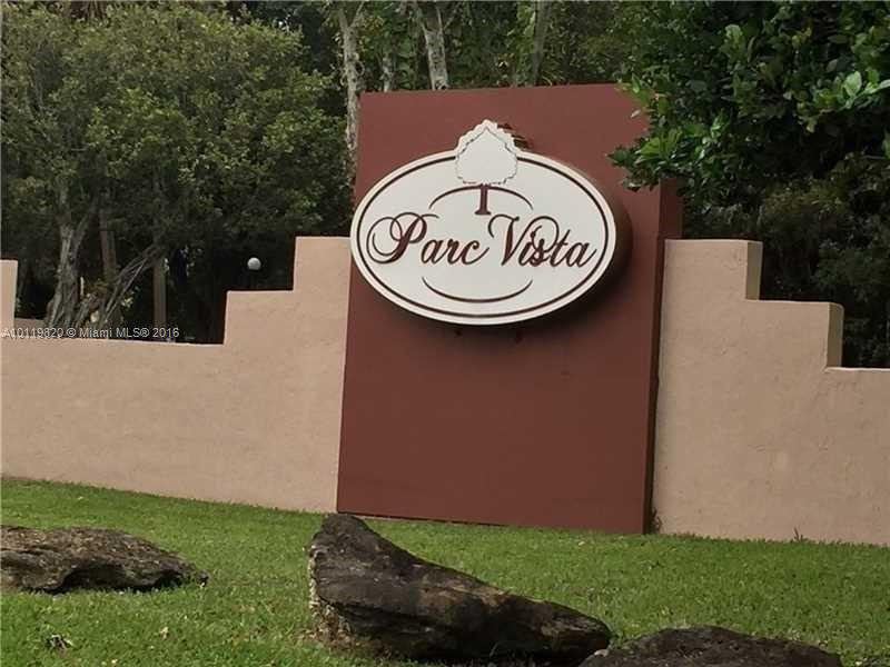 9079 Southwest 138th Place, Unit 9079 Miami, FL 33186 - Photo 21 of 34 a view of a bench in a park