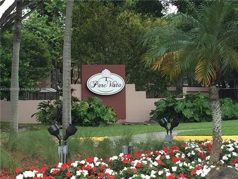 9079 Southwest 138th Place, Unit 9079 Miami, FL 33186 - Photo 25 of 34 a view of a and garden area
