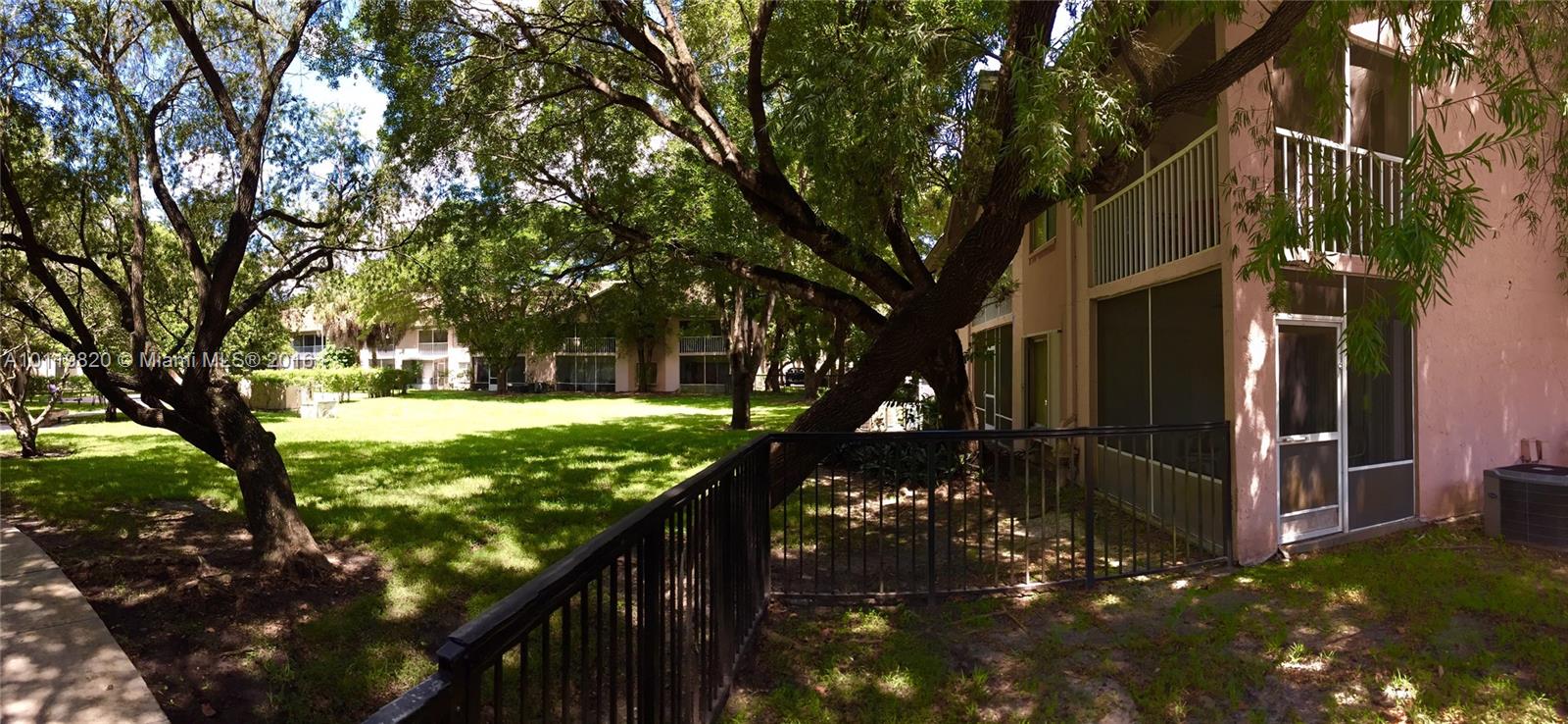 9079 Southwest 138th Place, Unit 9079 Miami, FL 33186 - Photo 32 of 34 a view of yard with patio