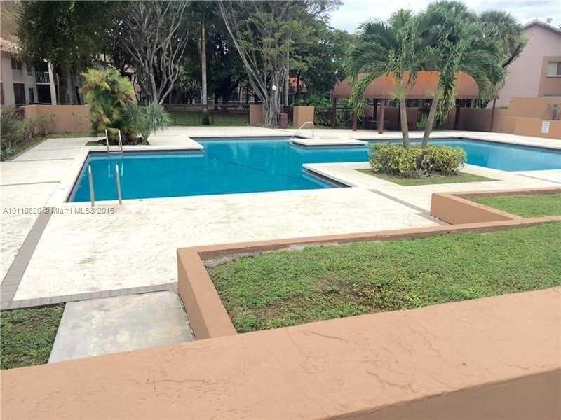 9079 Southwest 138th Place, Unit 9079 Miami, FL 33186 - Photo 5 of 34 a view of outdoor space yard and swimming pool
