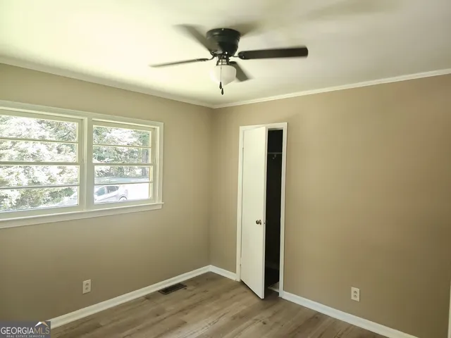 a view of an empty room with a window
