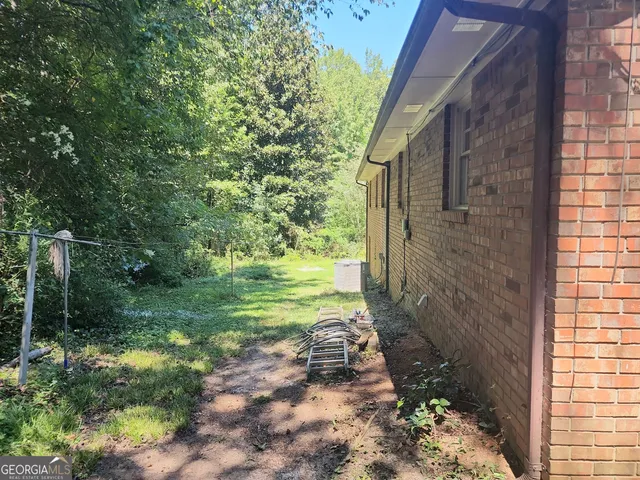 a backyard of a house with lots of green space