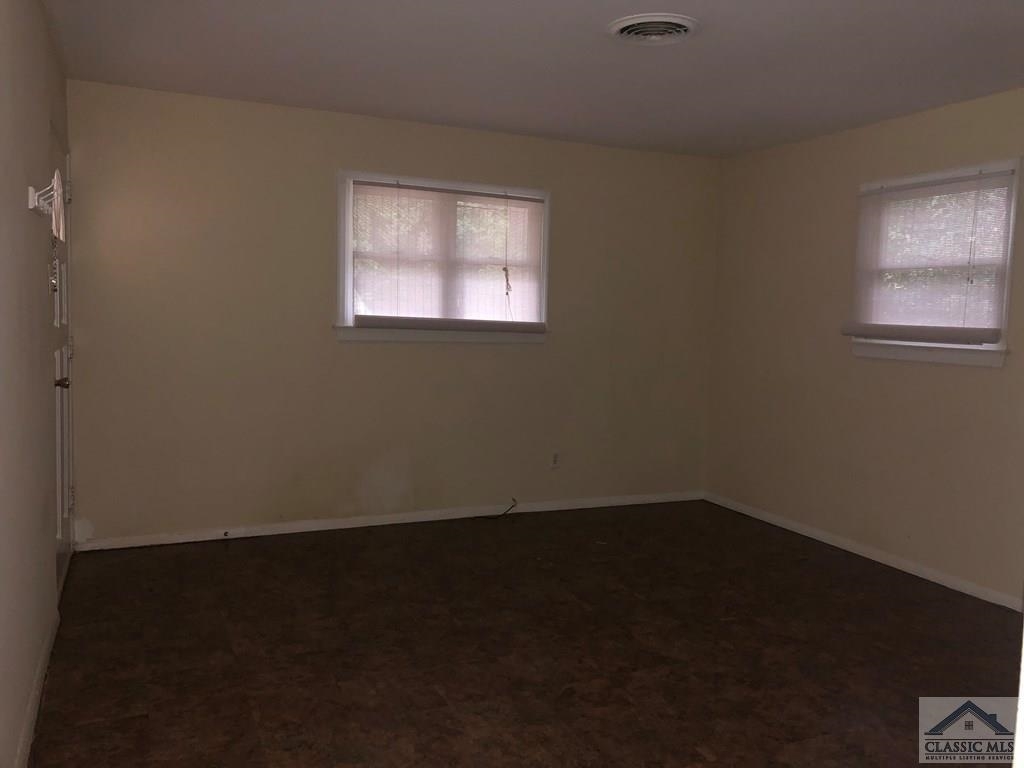 127 Pineview Drive Athens, GA 30606 - Photo 2 of 10 an empty room with a window