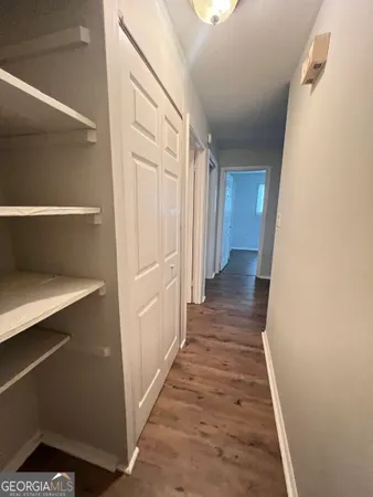 a view of gallery with wooden floor