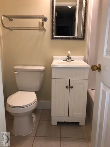 a bathroom with a sink toilet and vanity