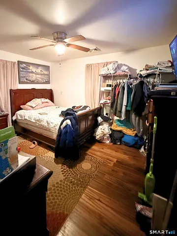 a bedroom with a bed and a mirror