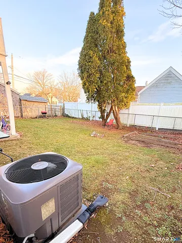 a bath tub sitting in middle of tall trees