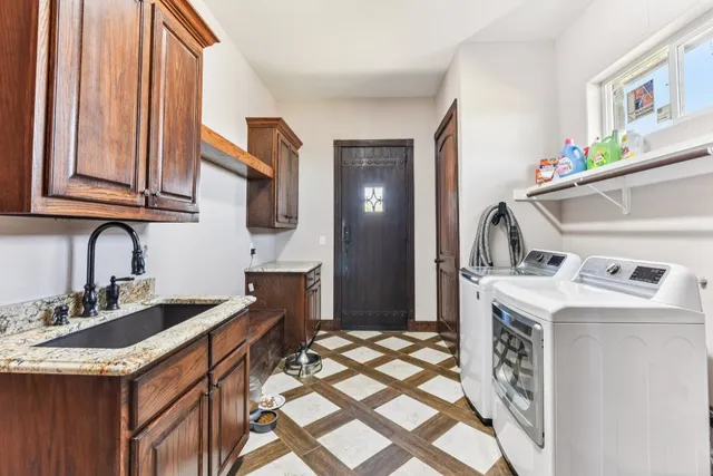 a kitchen with a sink stove and cabinets